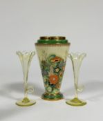 A Carlton Ware Art Deco stepped topped taper vase the top with gilt and green boarder above a floral