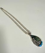 A sterling silver curb link necklace mounted with dragonfly, turquoise and labradorite pear shaped