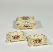 A Wedgewood art deco style trinket box and two small trinket dishes, decorated with gold enameling
