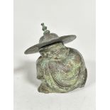 A bronzed metal figure of a crouching man with hat (h 15.5cm x 11cm x 8cm)