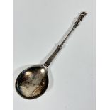 A 19thc Continental apostle spoon with spiral twist handle and figure holding a spear with scrolling