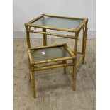 A graduated pair of mid century split cane and bamboo tables with inset glass tops, larger H59cm,