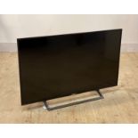 A Sony 42" flatscreen smart TV, with power cable and remote (untested)