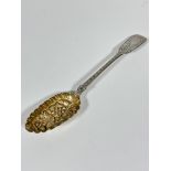A Victorian London 1845 silver chased Fiddle pattern berry spoon with gilt gilded bowl with berry