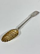 A Victorian London 1845 silver chased Fiddle pattern berry spoon with gilt gilded bowl with berry