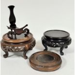 A Chinese hardwood plate stand, (h 13cm x 7cm x 10cm) a hardwood vase stand with pierced border