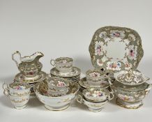 A 19th century Derby part tea service decorated with gold gilding and silver and floral enameling,