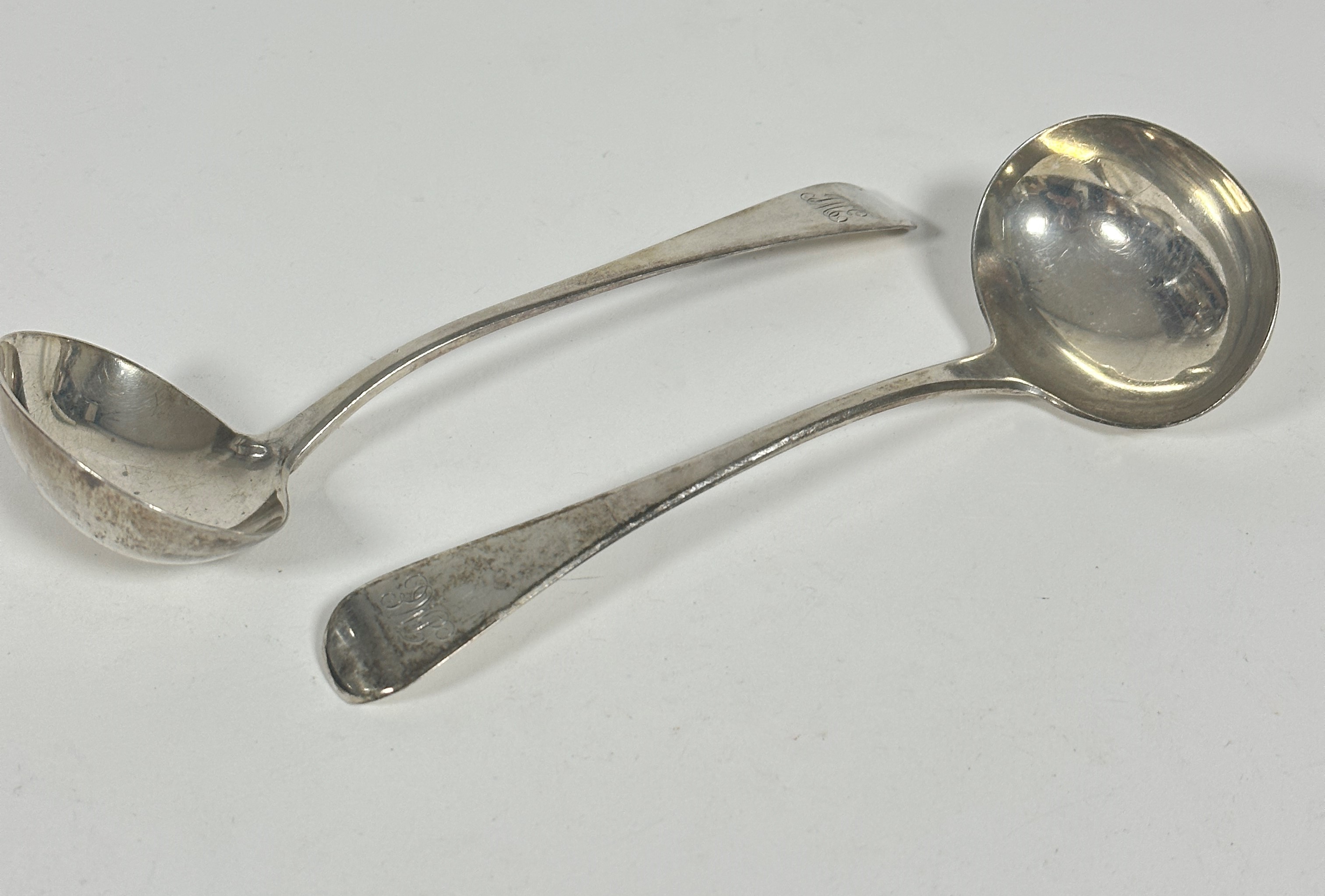 A pair of George III silver Old English pattern sauce ladles, mark unascribed, engraved initials