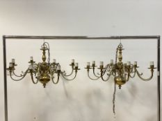 A near pair of Dutch style brass chandeliers, with eight scrolled branches, D85cm