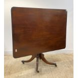 A George III mahogany tilt top breakfast table, the square top with reeded edge over ring turned