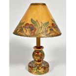 A 1920s birch wood table lamp with original card tube lined and painted shade and matching ball