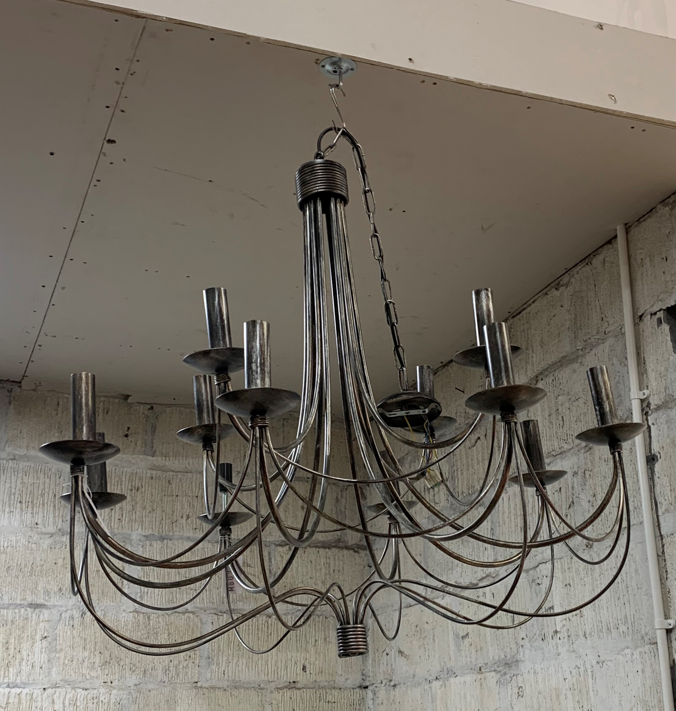 A large anodised metal twelve branch chandelier, H84cm