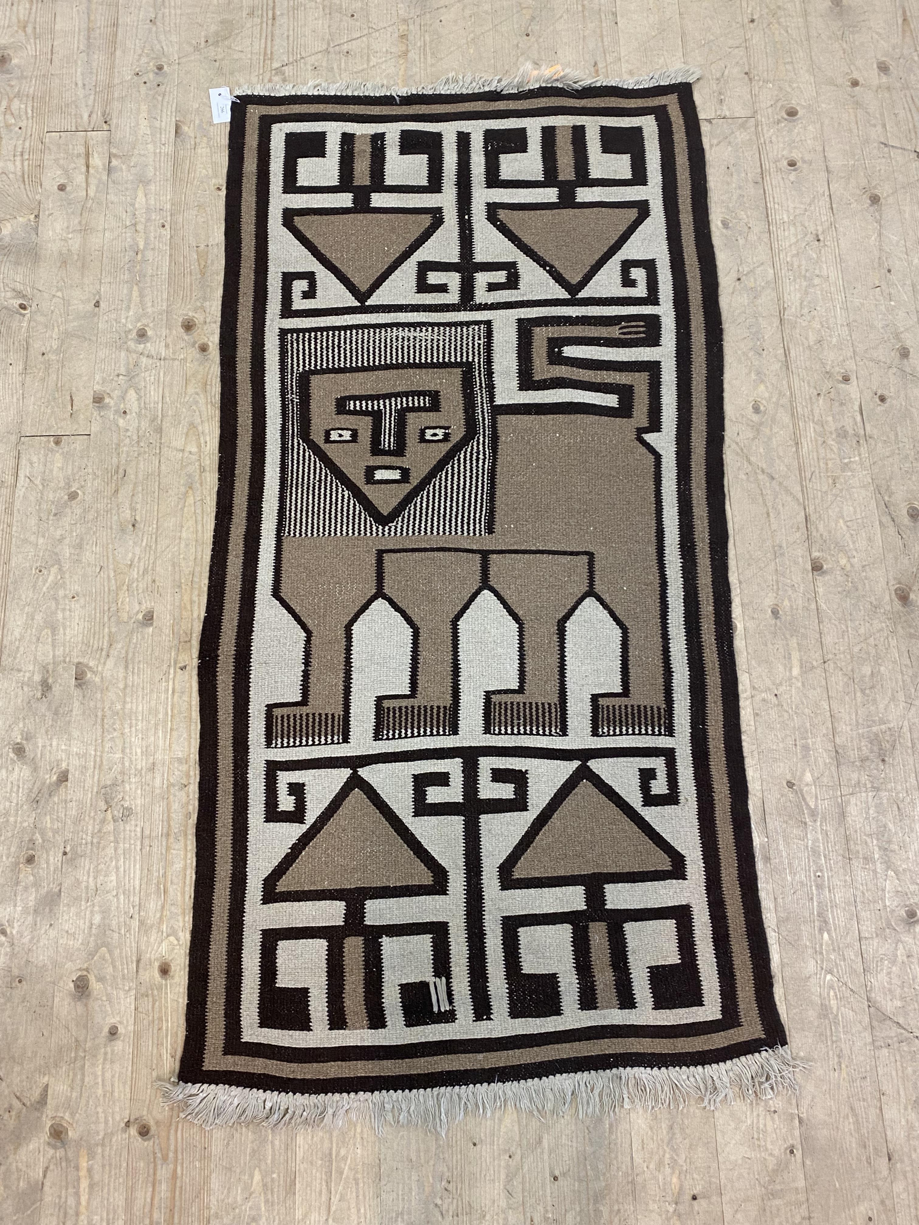 A North African flat weave rug, decorated in shades of brown with a stylised lion 170cm x 80cm - Image 2 of 2