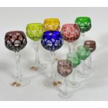A Nachtmann Bavarian set of six Harlequin coloured glass to clear hock glasses on faceted stems