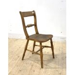 An early 19th century elm and beech vernacular rail back chair with ring turned supports, H81cm