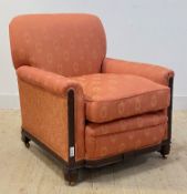 A mid 19th century mahogany upholstered armchair, the show frame carved in the Neoclassical taste,