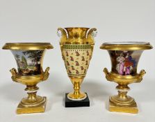 A pair of Continental vases decorated with landscape panels and figures with lion mask handles to