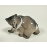 A Danish Royal Copenhagen porcelain brown bear, (h 9cm x 15cm x 6cm)