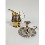 A 19thc Sheffield plated chamber candlestick of scalloped form with scroll handle to side, missing