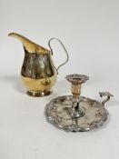 A 19thc Sheffield plated chamber candlestick of scalloped form with scroll handle to side, missing