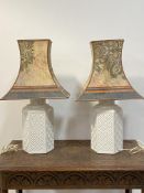 A pair of Italian white ceramic table lights of hexagonal outline with lozenge motif H68cm (