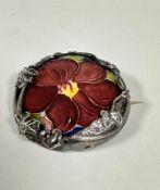A London silver mounted William Moorcroft circular panel with stylised anemone flower and