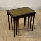 A mahogany nest of three tables inset with green tooled leather tops, H52cm, W55cm, D38cm