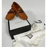 A pair of gentleman's Gucci tan leather driving shoes, 13b, shows little to no signs of use,