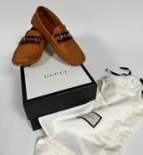 A pair of gentleman's Gucci tan leather driving shoes, 13b, shows little to no signs of use,