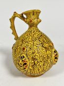 A Hungarian pottery Zsolnay Pecs style ovoid jug with moulded lava style decoration, lotus leaf