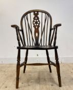 An early 20th century ash and beech Windsor chair, hoop and spindle back over shaped seat and turned