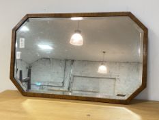 An Edwardian octagonal walnut framed wall mirror, 44cm x 71cm