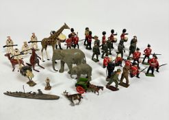 A collection of die cast model animals including an elephant and her baby, an ostrich, a kangaroo, a