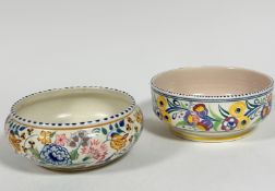 A 1920s / 1930s Poole pottery fruit bowl decorated with yellow and purple flowers and scrolling