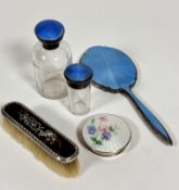 A white metal enamelled dressing table hand mirror with pale blue guilloche enamelled decoration,