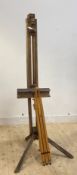 A mid 20th century artists' folding and telescoping beech easel, on tripod support, together with