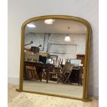 A Victorian style gilt arched framed over mantel mirror, 122cm x 124cm