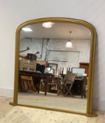 A Victorian style gilt arched framed over mantel mirror, 122cm x 124cm