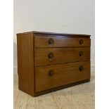 A mid century teak chest, circa 1960's, fitted with three graduated drawers H71cm, W103cm, D42cm
