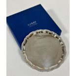 A modern silver scalloped Georgian style card waiter with engraved initials DWHH, stamped 925 and