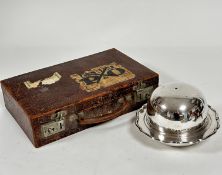 A vintage embossed leather writing case, c.1900 with part fitted interior, complete with blotter,