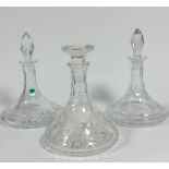 A pair of Edinburgh Crystal slice cut ships' port decanters with star cut design and faceted