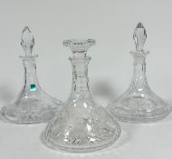 A pair of Edinburgh Crystal slice cut ships' port decanters with star cut design and faceted