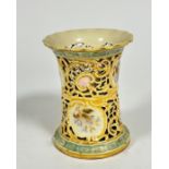 A Zsolnay Pecs Hungarian porcelain pierced cylinder vase decorated with scrolling design and