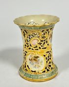 A Zsolnay Pecs Hungarian porcelain pierced cylinder vase decorated with scrolling design and