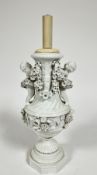 A Meissen blanc de chine porcelain baluster vase lamp, the moulded top with twin putti figures