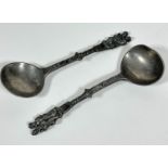 A pair of 19thc pewter spoons with apostle style figures, one bowl is a/f, unmarked, (L 18cm x 6cm)