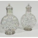A pair of Edwardian clear lustre and black enamelled white dotted outlined moon style flask vases