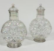 A pair of Edwardian clear lustre and black enamelled white dotted outlined moon style flask vases