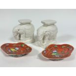 A pair of blanc de chine Chinese elephant stands with octagonal tops on moulded bases, (h16cm x 11cm